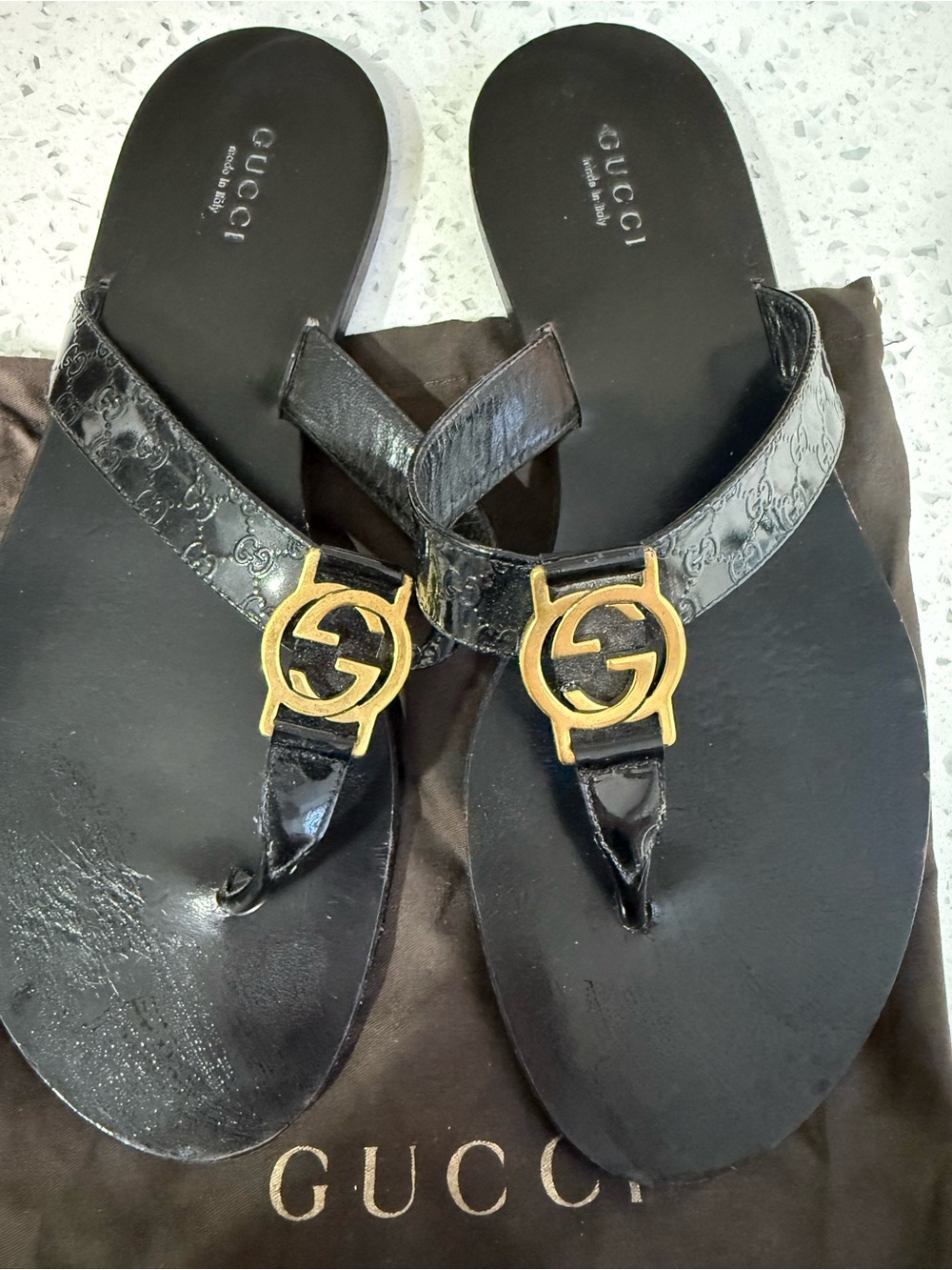 Gucci Black Leather Thong Sandals with Gold GG Emblems